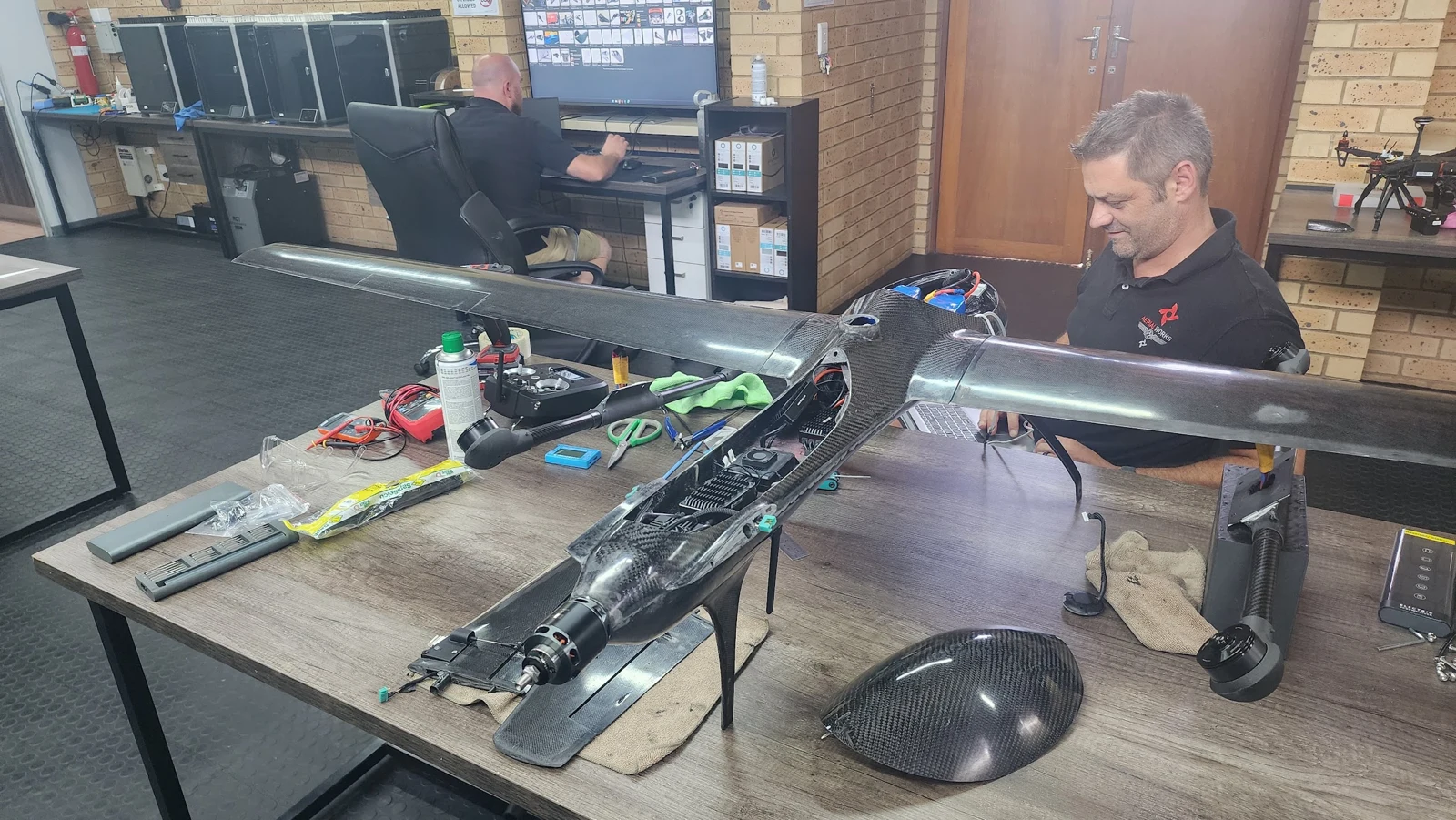 Carbon-fibre G2 VTOL airframe on a workbench during development
